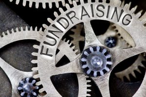 Cogwheel working together, the concept of fundraising
