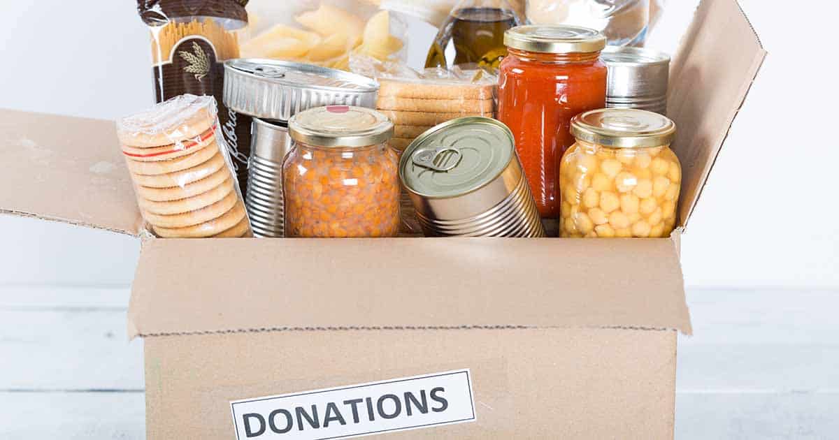 Donation box filled with canned food, Food donation concept